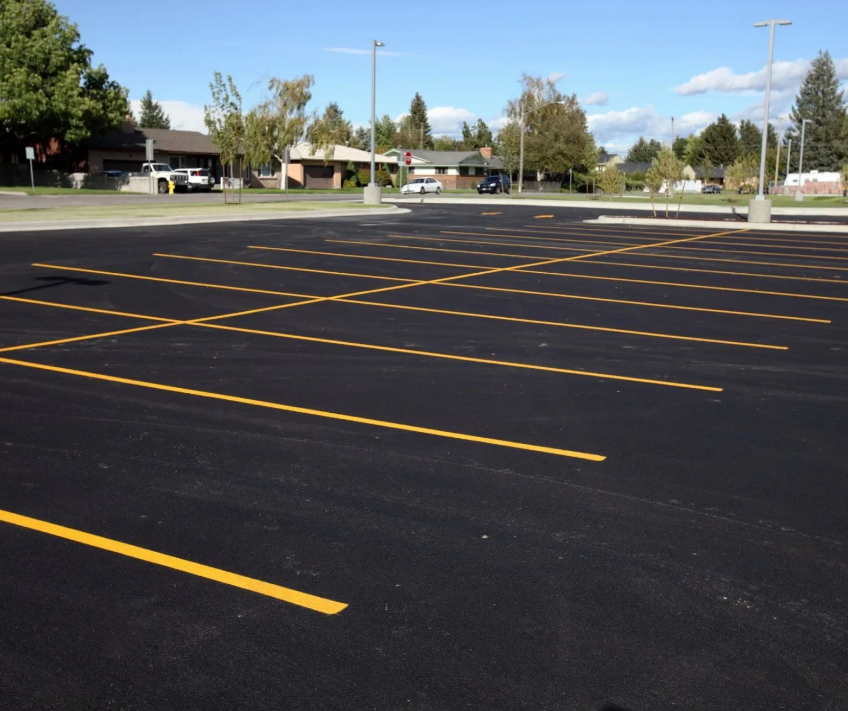Empty parking lot with clear yellow lines.