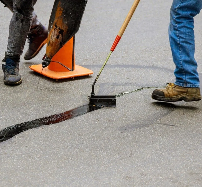 Asphalt maintenance with sealing equipment