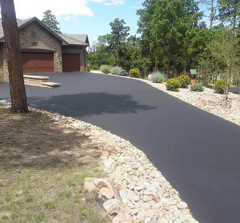 Freshly paved driveway with stone edging